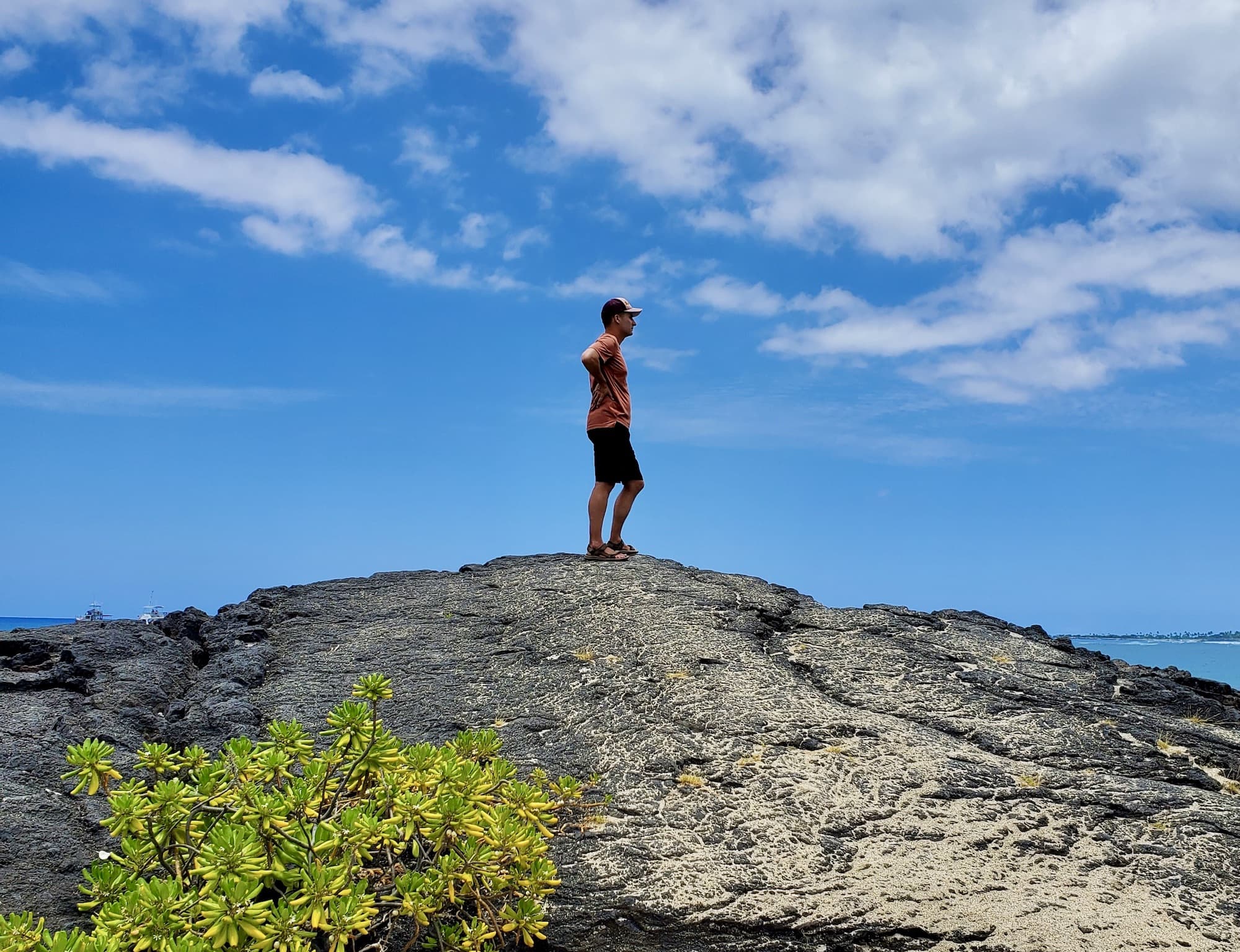 Arthur stands atop a rock at Kiholo Bay 