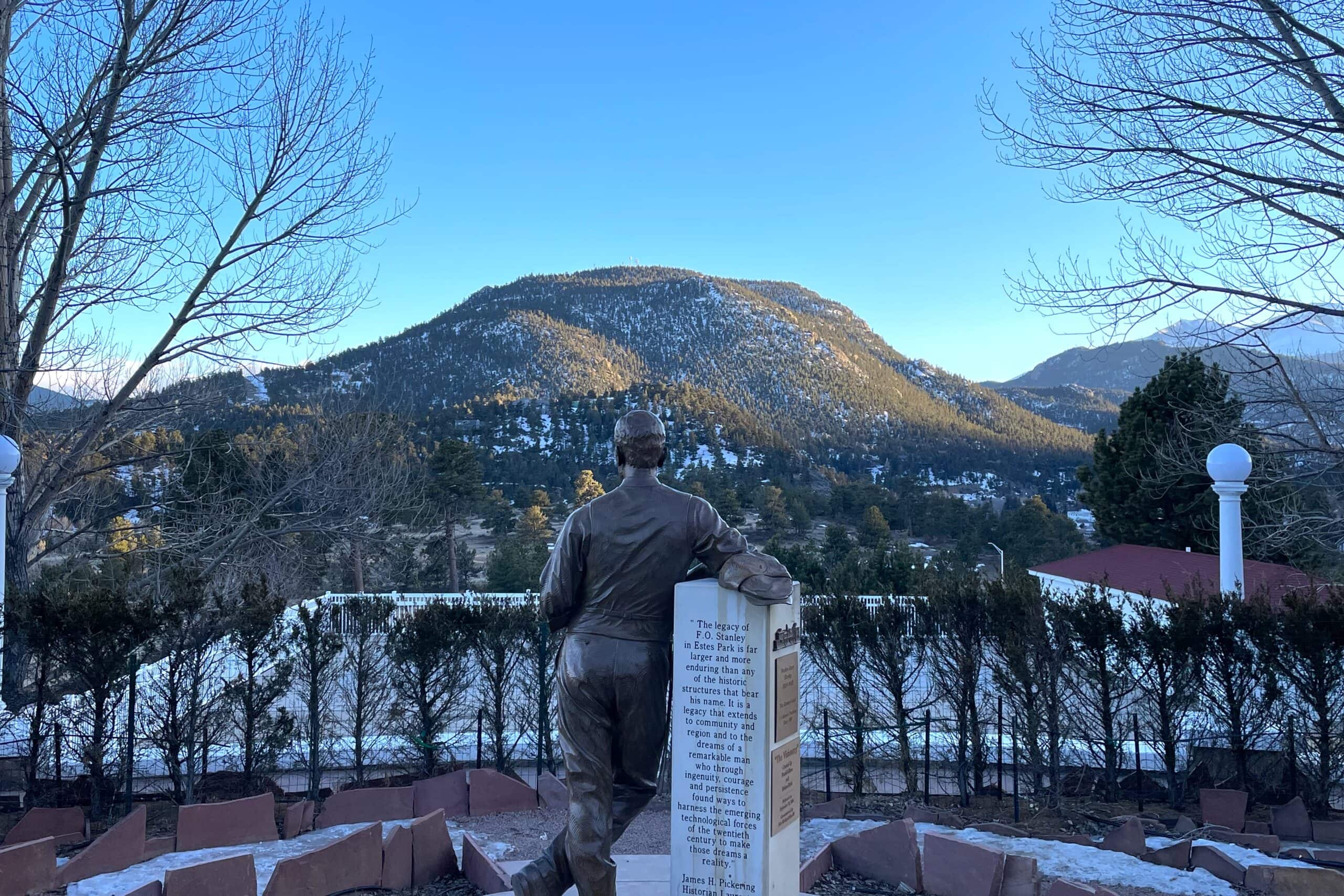 A statue overlooks the town of Estes Park