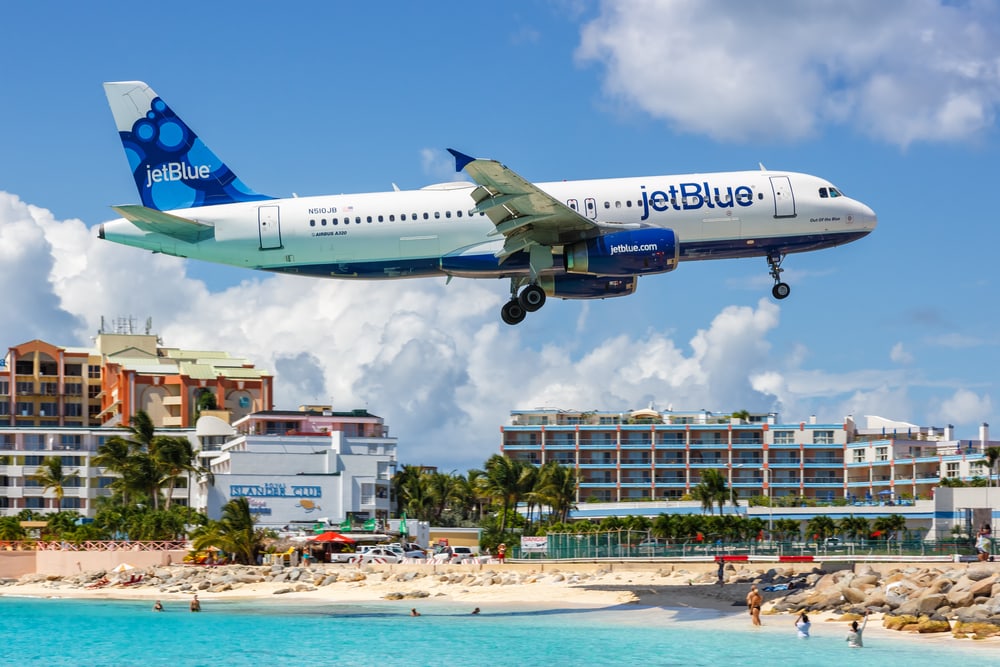 A JetBlue plane lands in the Caribbean.