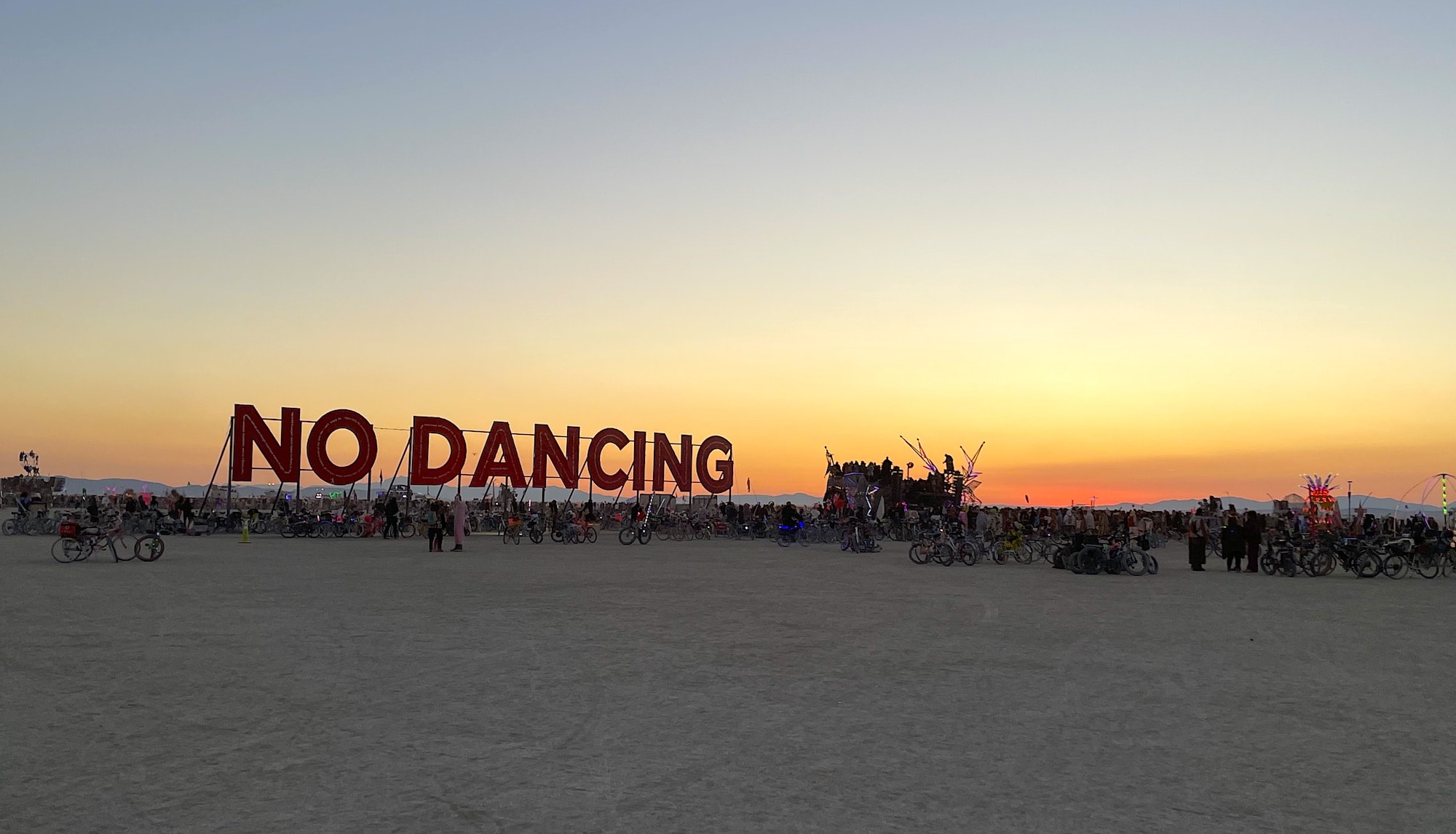 A No Dancing sign in the Nevada desert at Burning Man