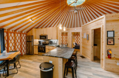 Inside the giant living area of a wooden yurt