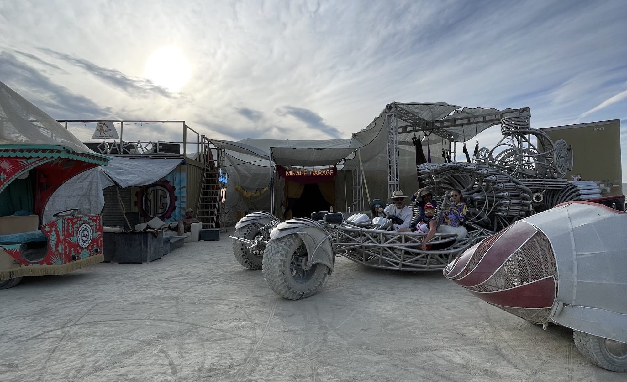 People sit in a dune buggy at Burning Man