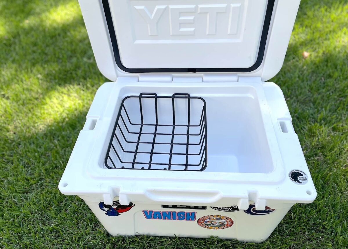 A YETI cooler sits opened on the grass