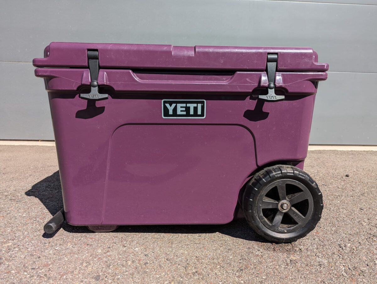 A purple YETI rolling cooler