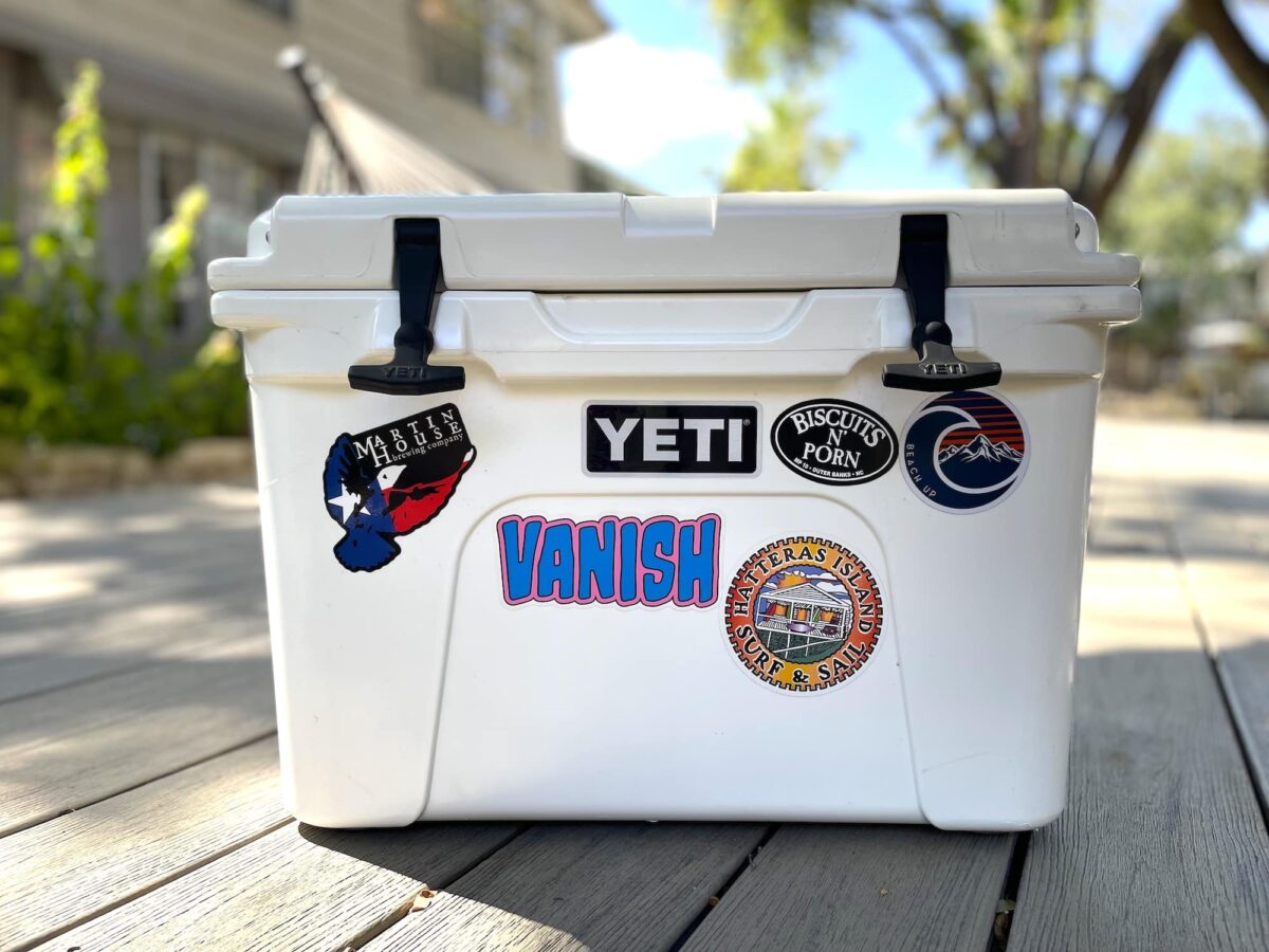 A white YETI cooler sits in the sun